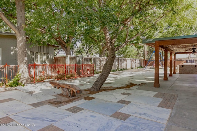 5412 20th St, Lubbock, TX 79407 - fenced backyard with a patio area and ceiling fan