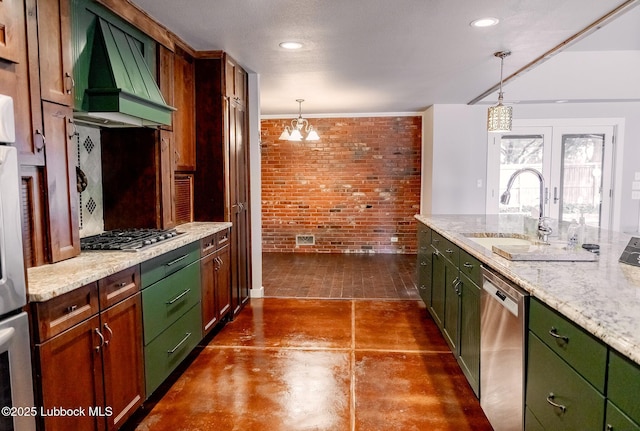 5412 20th St, Lubbock, TX 79407 - kitchen featuring brick wall, stainless steel appliances, custom range hood, a sink, and green cabinets