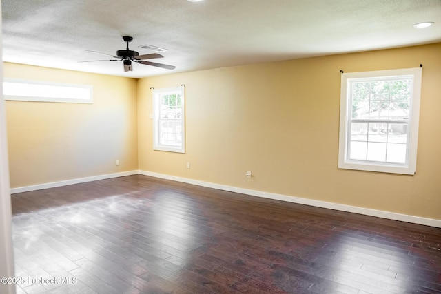 5412 20th St, Lubbock, TX 79407 - unfurnished room with a ceiling fan, dark wood-style flooring, plenty of natural light, baseboards, and a textured ceiling
