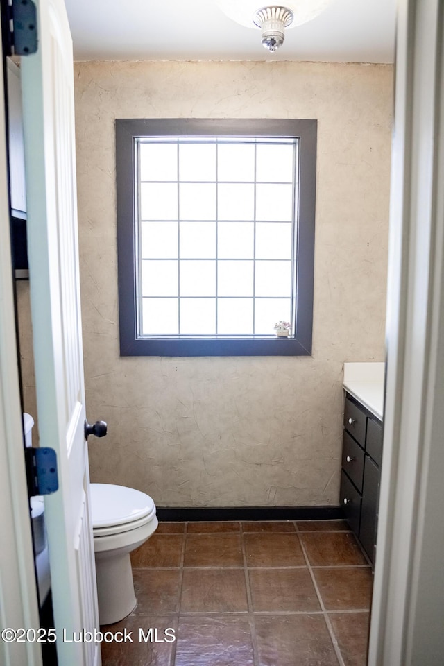 5412 20th St, Lubbock, TX 79407 - bathroom with vanity, healthy amount of natural light, and toilet