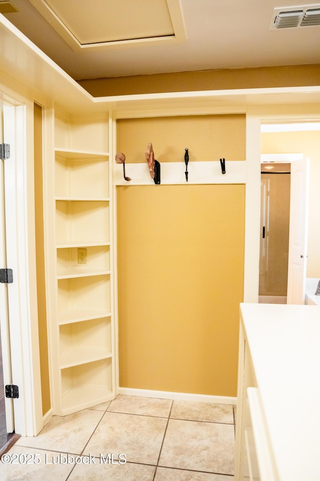 5412 20th St, Lubbock, TX 79407 - mudroom with light tile patterned floors and baseboards