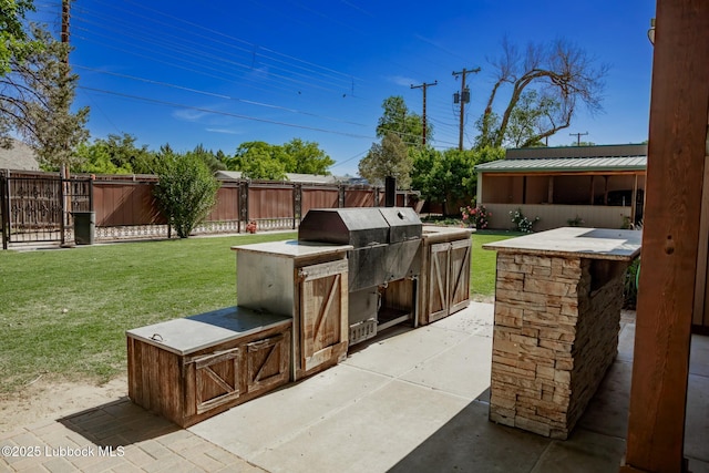 5412 20th St, Lubbock, TX 79407 - view of patio featuring an outdoor kitchen