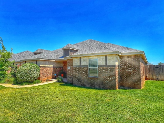 rear view of house with a yard