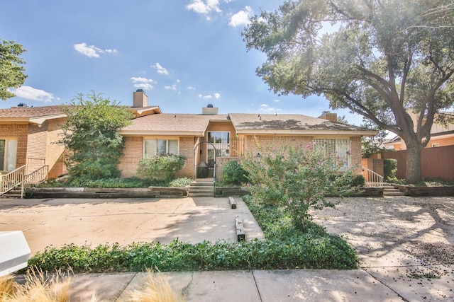 ranch-style home featuring a patio