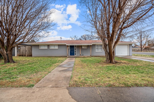 single story home with a garage and a front yard