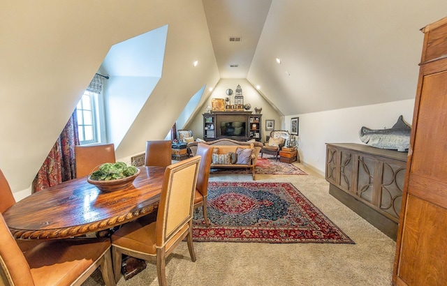 interior space with lofted ceiling and light colored carpet