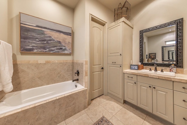 bathroom featuring vanity, tiled bath, and tile patterned floors