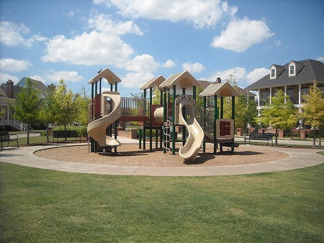 view of playground with a lawn