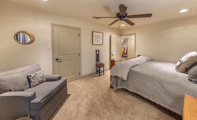 carpeted bedroom featuring ceiling fan