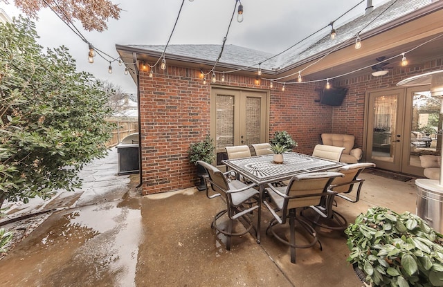 view of patio with a grill and french doors