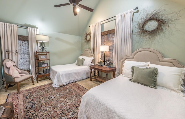 bedroom with ceiling fan, carpet flooring, and high vaulted ceiling