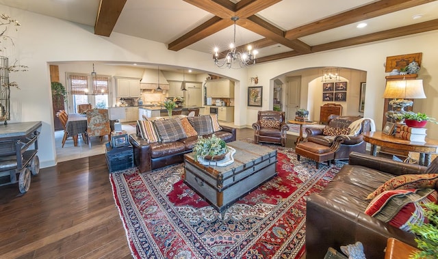 living room featuring an inviting chandelier, dark hardwood / wood-style flooring, coffered ceiling, and beamed ceiling