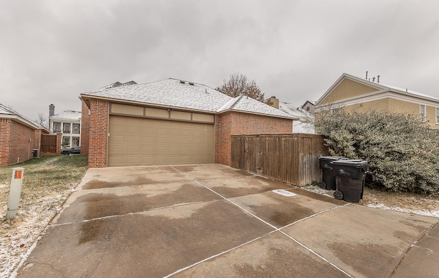 view of side of property with a garage