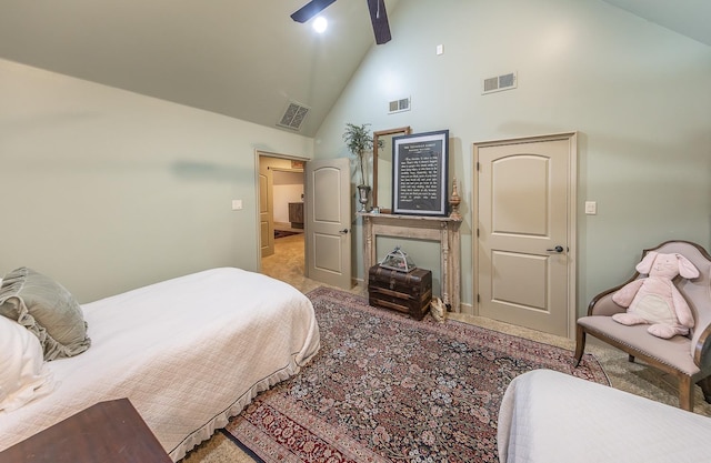 carpeted bedroom with high vaulted ceiling and ceiling fan