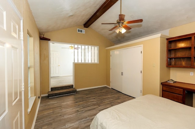 bedroom with lofted ceiling with beams, dark hardwood / wood-style floors, and ceiling fan