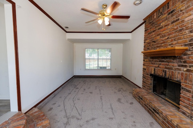 unfurnished living room featuring crown molding, a brick fireplace, carpet, and ceiling fan