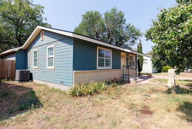 view of front of house featuring central air condition unit