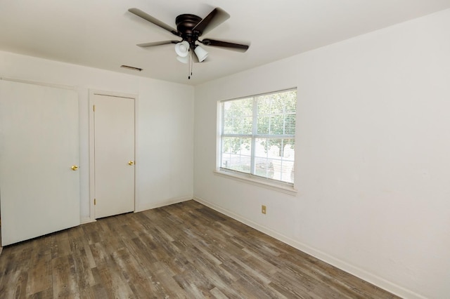 unfurnished bedroom featuring wood-type flooring and ceiling fan