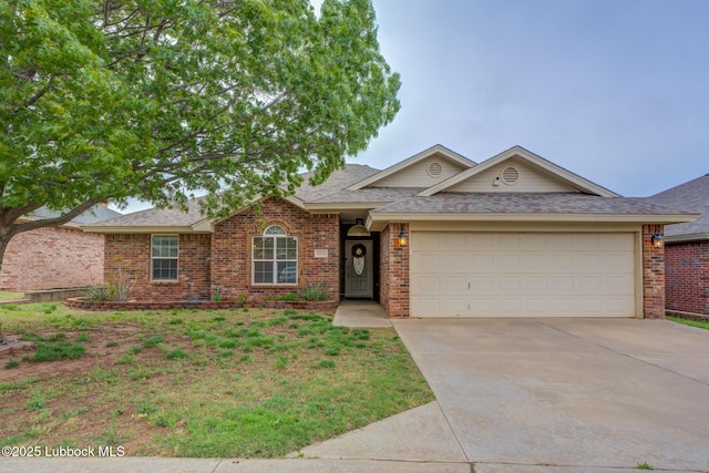 5516 101st Pl, Lubbock, TX 79424 - view of front of property featuring concrete driveway, brick siding, and roof with shingles
