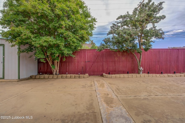 2608 74th Pl, Lubbock, TX 79423 - fenced backyard with a patio