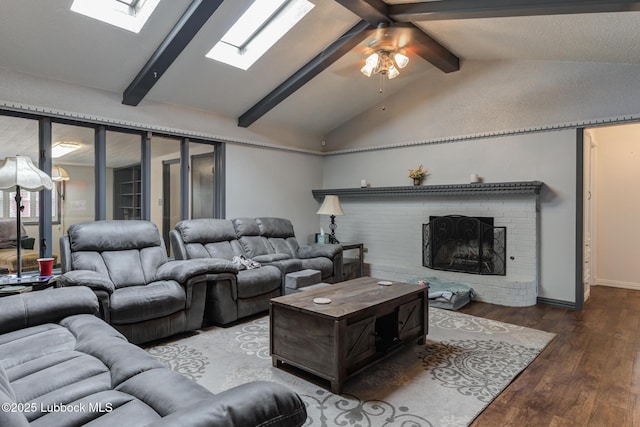 2608 74th Pl, Lubbock, TX 79423 - living area featuring a skylight, wood finished floors, a ceiling fan, and a brick fireplace