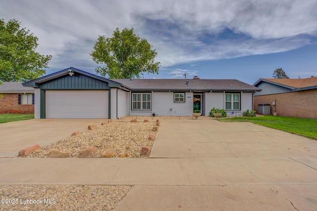 2608 74th Pl, Lubbock, TX 79423 - ranch-style house featuring driveway, an attached garage, and board and batten siding