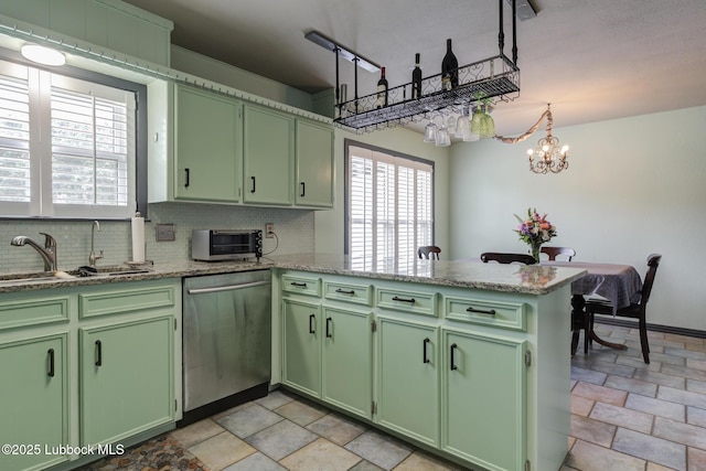 2608 74th Pl, Lubbock, TX 79423 - kitchen with green cabinetry, stainless steel dishwasher, and a peninsula