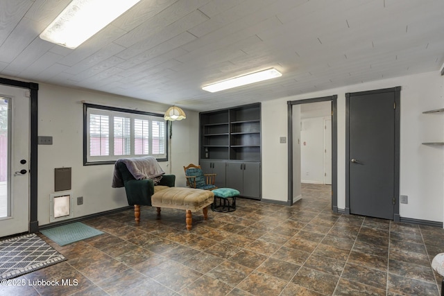 2608 74th Pl, Lubbock, TX 79423 - living area with plenty of natural light and dark stone finish flooring