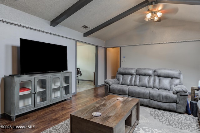 2608 74th Pl, Lubbock, TX 79423 - living area with dark wood finished floors, ceiling fan, and a textured ceiling