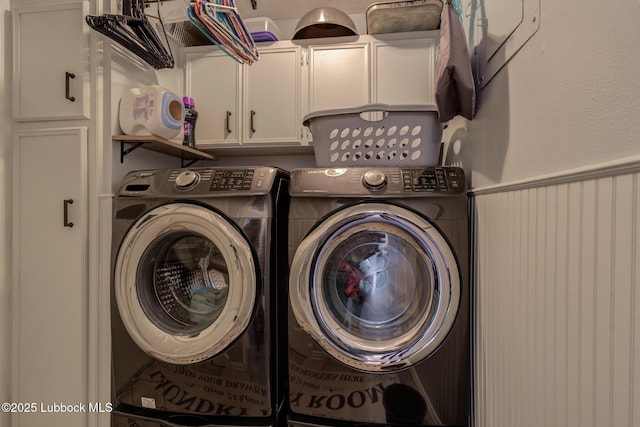 2608 74th Pl, Lubbock, TX 79423 - washroom featuring cabinet space, independent washer and dryer, and a wainscoted wall
