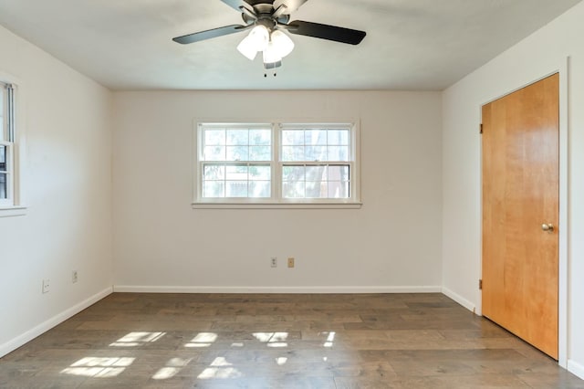 unfurnished room with hardwood / wood-style flooring and ceiling fan