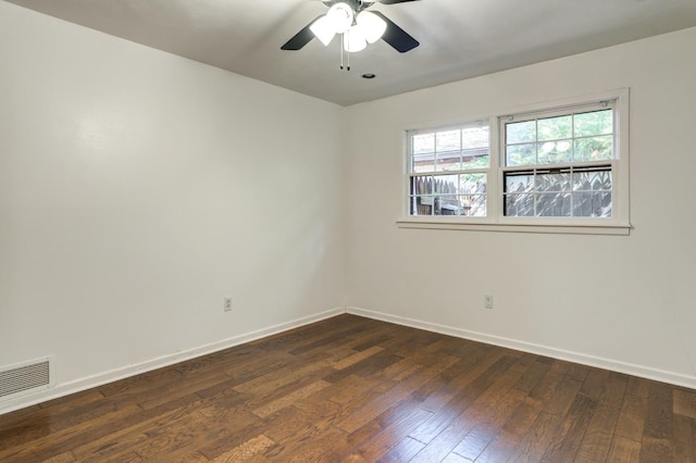 unfurnished room with ceiling fan and dark hardwood / wood-style flooring