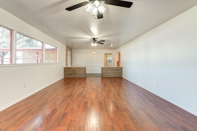 unfurnished living room featuring hardwood / wood-style floors