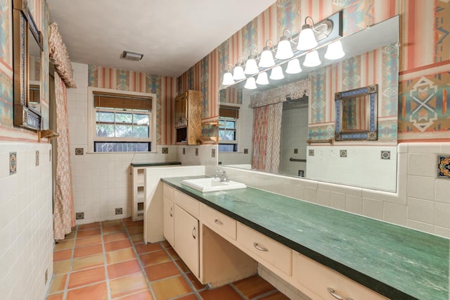 bathroom featuring tile patterned floors, vanity, and tile walls