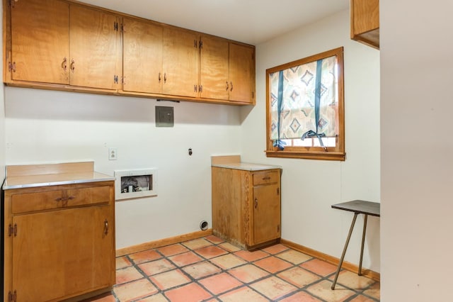 laundry room with hookup for a washing machine and cabinets