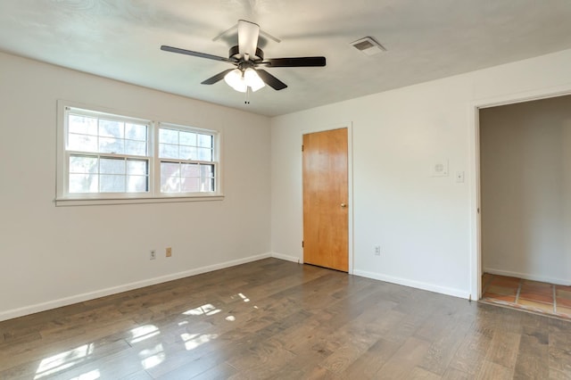 unfurnished bedroom with ceiling fan and dark hardwood / wood-style flooring