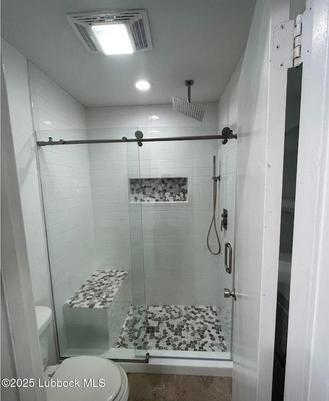 full bathroom with toilet, a shower stall, visible vents, and recessed lighting