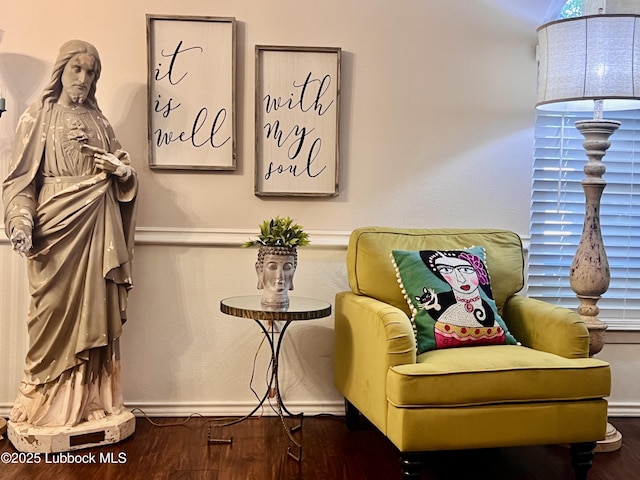 sitting room featuring wood finished floors and baseboards