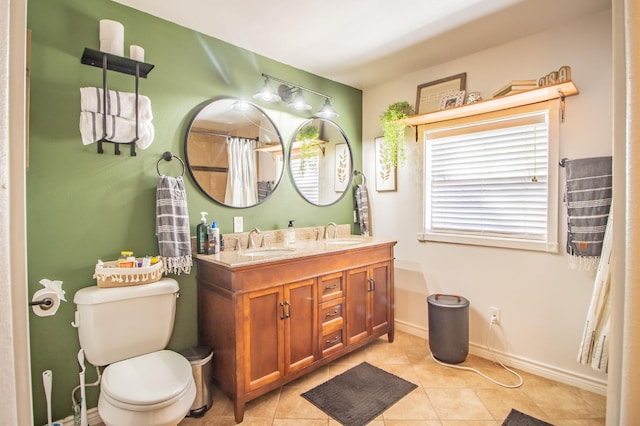 bathroom with a shower with curtain, vanity, tile patterned floors, and toilet