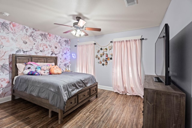 bedroom featuring dark wood-type flooring and ceiling fan