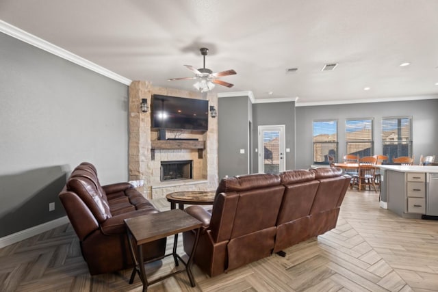 living room with ceiling fan, ornamental molding, light parquet flooring, and a fireplace