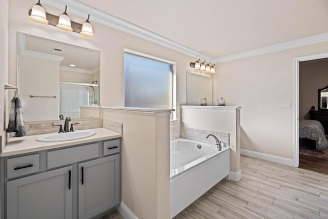 bathroom featuring hardwood / wood-style flooring, vanity, crown molding, and independent shower and bath