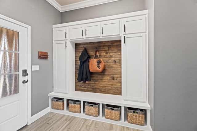 mudroom featuring crown molding and light hardwood / wood-style floors