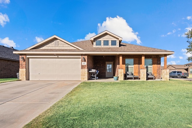 view of front of house with a garage and a front yard