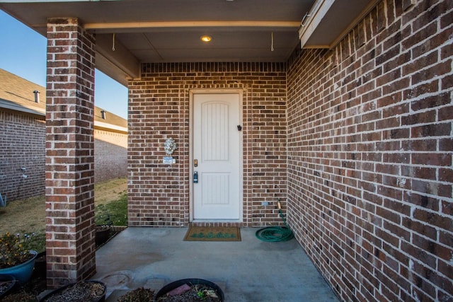 doorway to property with a patio area