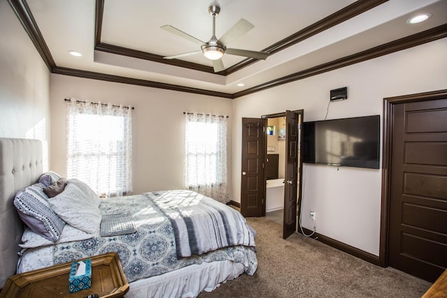 carpeted bedroom with crown molding, ceiling fan, and a raised ceiling