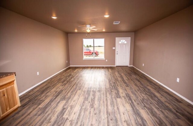 interior space featuring dark hardwood / wood-style floors and ceiling fan