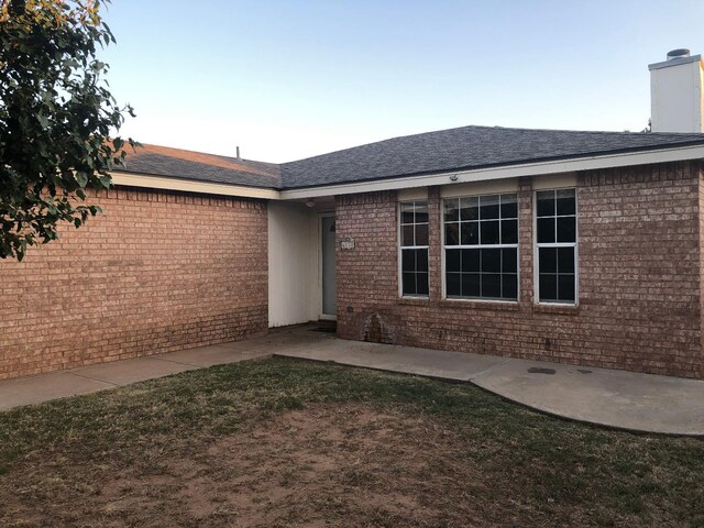 doorway to property with a patio area