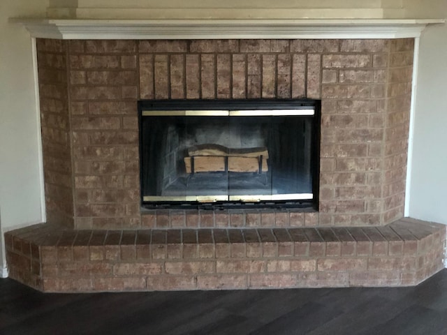 interior details with a brick fireplace