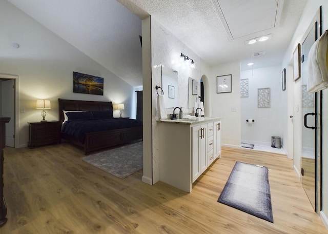 bathroom with vanity, hardwood / wood-style floors, and a textured ceiling